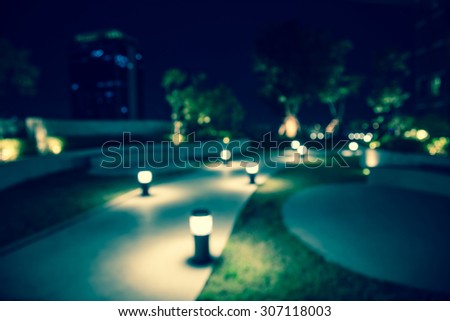 Defocused walkway in night garden background - Stock Image - Everypixel