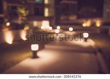 Defocused walkway in night garden background - Color tone effect