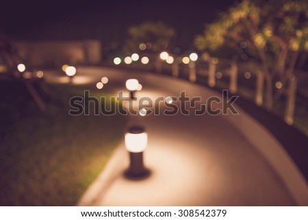 Defocused walkway in night garden background - Color tone effect