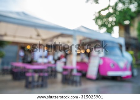 Abstract blurred background outdoor coffee shop pink vintage car