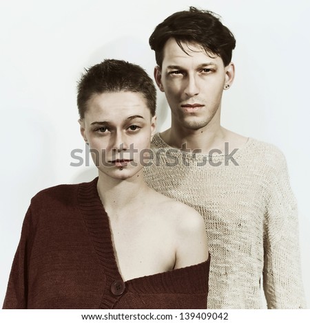 Studio portrait of a young man and woman on a white background