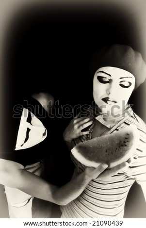 Portrait of mimes on a black background with a water-melon piece\
\
MORE  IMAGES FROM THIS SERIES IN MY PORTFOLIO