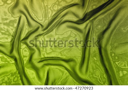 Texture of green satin silk close up