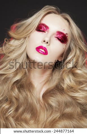 Beautiful Blond Woman. Curly Long Hair, brigth make up,pink lips, pink shadow,art style,Fashion model with long blond hair. Glitter shadow