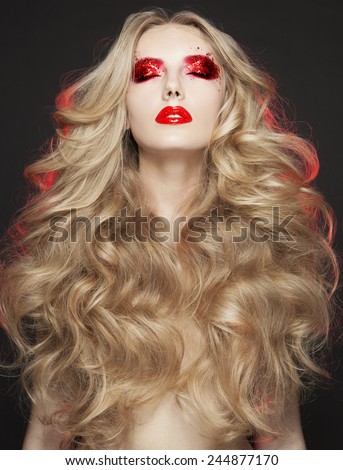 Beautiful Blond Woman. Curly Long Hair,brigth make up,red lips,red shadow,art style,Fashion model with long blond hair.