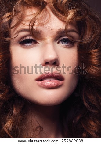 Portrait of a Beautiful Girl With Healthy Long Red Hair. Wavy Hair.Hairstyle. Make-up. Hairdressing.
