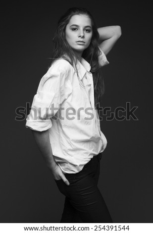 Young gorgeous model with a white shirt, black or white photo