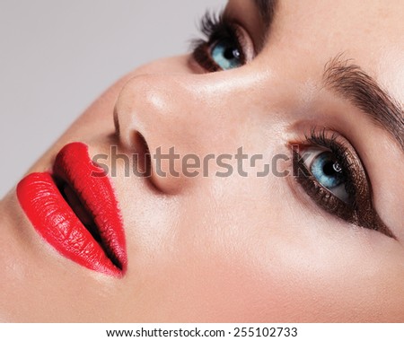 Beautiful woman with bright make up eye with sexy black liner makeup. Fashion big arrow shape on woman\'s eyelid. Chic evening make-up
