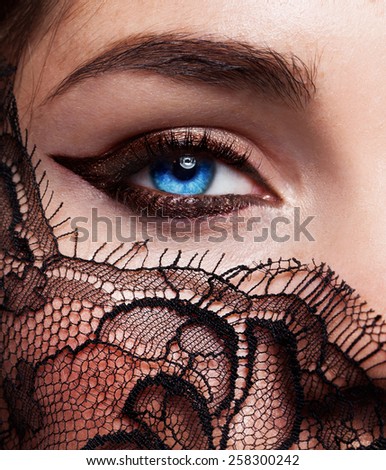 Beautiful fashion girl with arrow make up. Closeup female eye with beautiful fashion bright makeup.