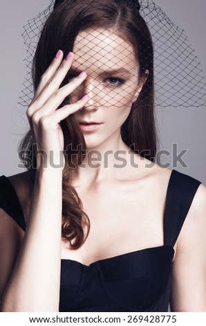 Close-up portrait of beautiful model with bright make up, on grey background fashion party style