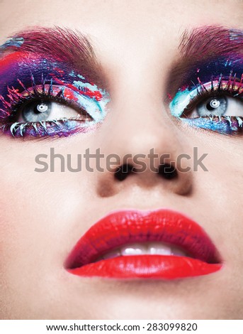 Colorful lashes,Macro shot of woman's beautiful eye with extremely long eyelashes. Sexy view, sensual look,blue eyes,art