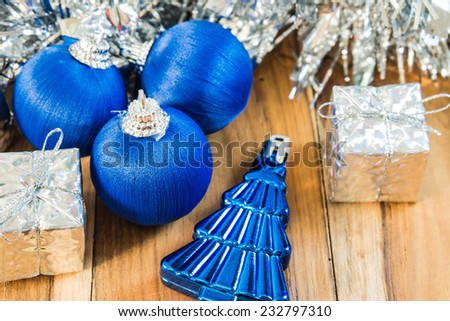 Blue decorated for Christmas and New Year. On the background of wooden