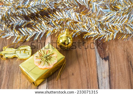 Golden Christmas and New Year decoration on the wooden floor.