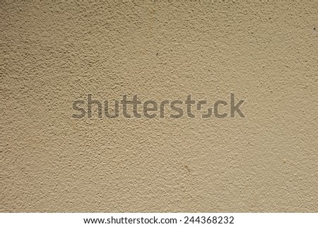 Cream paint cement wall texture background.