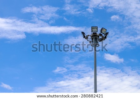 light pole and blue sky with clouds