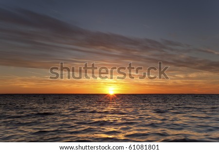Summer sun goes down over the ocean, Swedish coastline