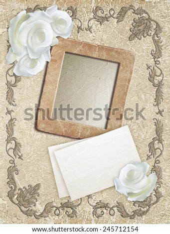 Old grunge photo frame with roses and paper for letter