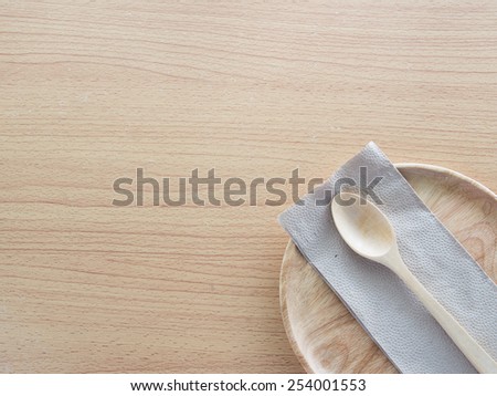 Wood spoon with Napkin on wood plate