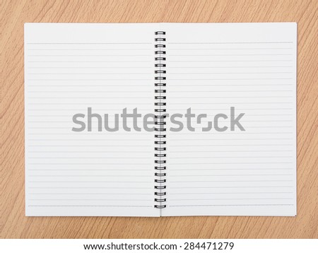 Ring binding notebook on wooden background