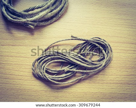 Recycle rope on wooden background, Vintage Filter process