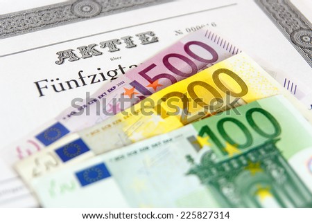 Share with fanned out Euro banknotes and depth of focus