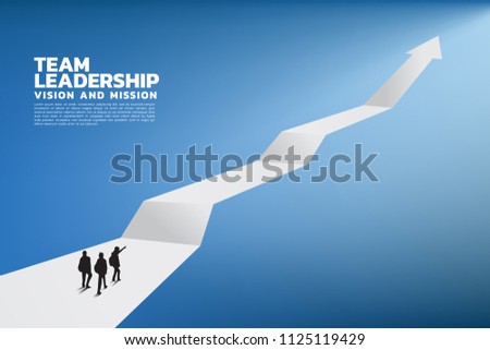 Silhouette of a team leader look up to business growing arrow, Concept of teamwork, leadership, Goal, Mission and Vision, 