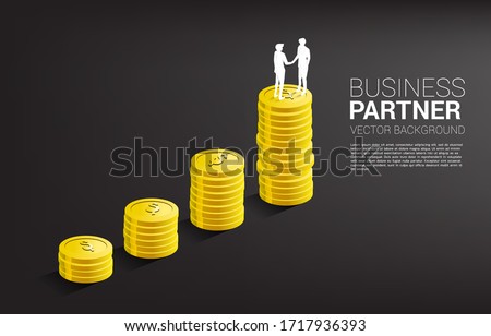 Silhouette of businessman handshake on top of coin graph . Concept of t business partnership and cooperation.