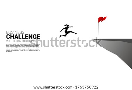 silhouette of businesswoman jumping to flag on cliff. Business Concept of targeting and customer.route to success.