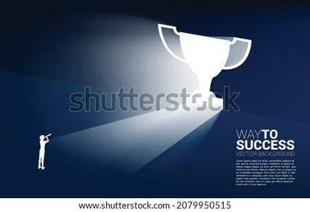 Silhouette of businessman and telescope looking to light from exit door shape trophy. Business Concept of route to winner and champion