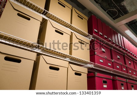 Rows of stacked storage boxes stacked on shelves