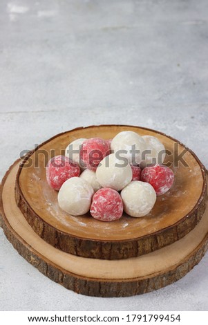 Moci merah putih. Red and White Mochi or moci cake. One of traditional snack from Indonesia. Made from glutinous rice flour with sugar and roasted peanut filling. Foto d'archivio © 