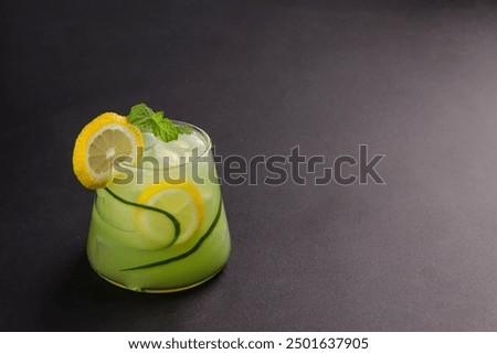 Similar – Image, Stock Photo Lemonade glass with cucumber and lime. Summer cocktail