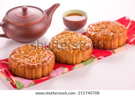 Moon cake and tea,Chinese mid autumn festival food. Isolated on white
