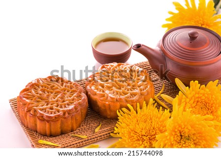 moon cake and tea for Chinese mid autumn festival. Isolated on white. Copy space