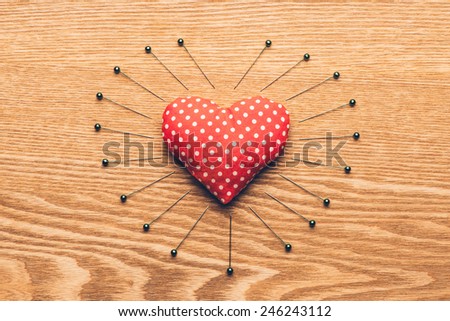 vintage heart and needles on wooden desk. Vintage style. Valentines day concept