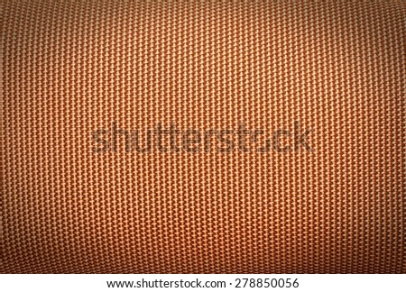 Abstract dark brown background from synthetic fabric in black shadow