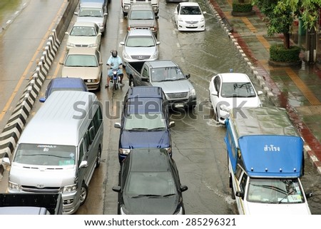 SAMUTPRAKARN THAILAND - JUN 8 : Traffic jam due to flooding from rain on Jun 8, 2015 at Poochaosamingprai road in Samutprakarn, Thailand