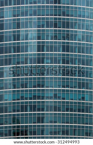 Detail of the facade of skyscrapers with reflection of the sky and other buildings