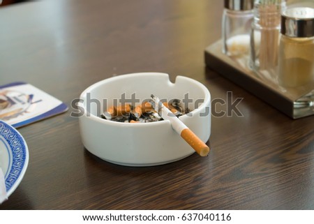 Similar – Image, Stock Photo Ashtray with cigarettes