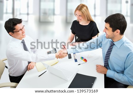 Friendly handshake on business meeting in the office