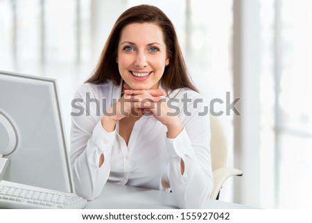 Portrait of business woman working with computer