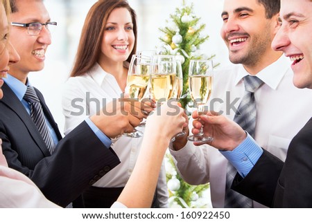 Happy people with of crystal glasses full of champagne