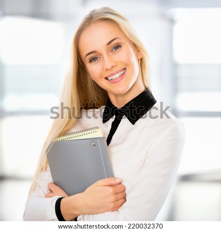 Portrait of a young business woman in an office