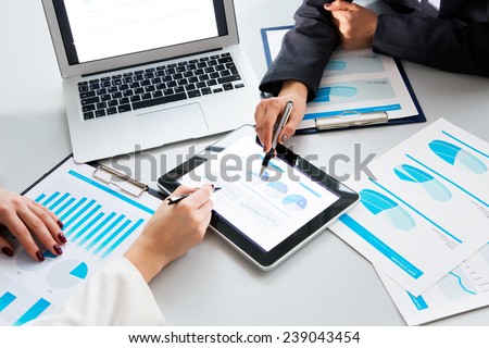Image of human hands during paperwork at meeting