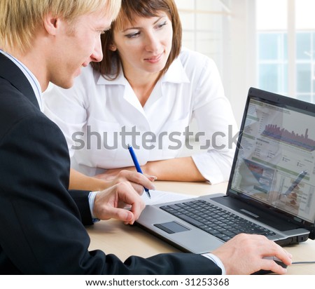 Confident business people doing some computer work together