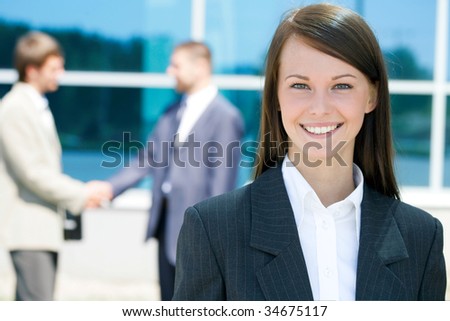 Successful young business woman with charming smile