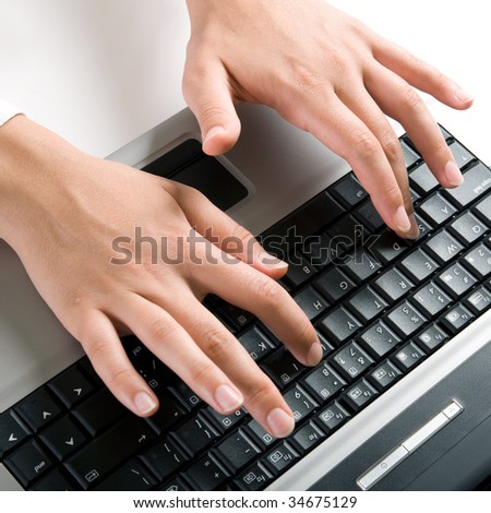 Photo of female hands typing a letter on the laptop