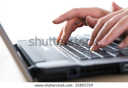 Image of human hands doing some computer work