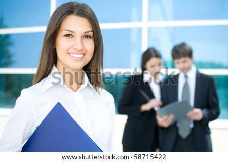 Beautiful woman on the background of business people