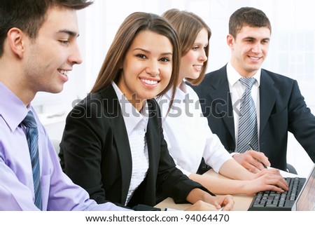 Portrait of female leader with cheerful team